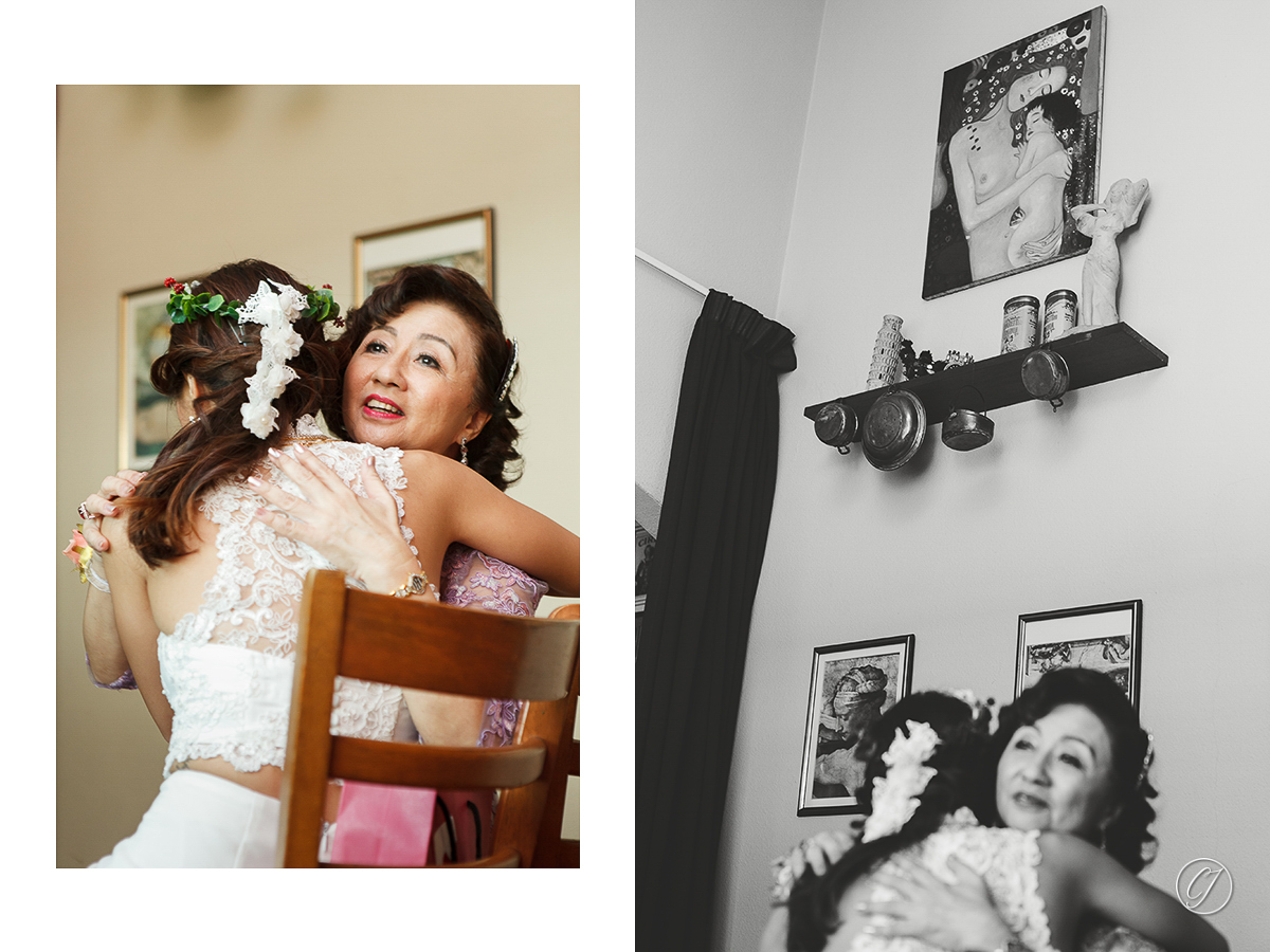 Bride and mother hugging during the tea ceremony