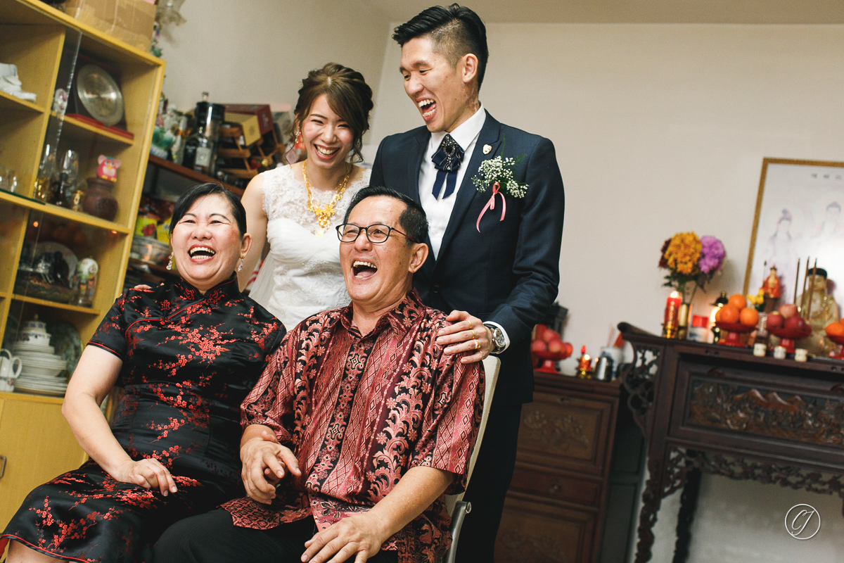 Laughing family portrait on wedding