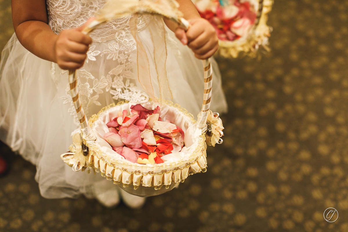 Flower girl with basket of flower petals