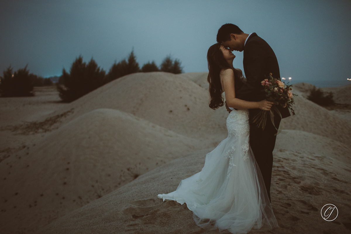 Engagement portrait couple, with wildflowers bouquet