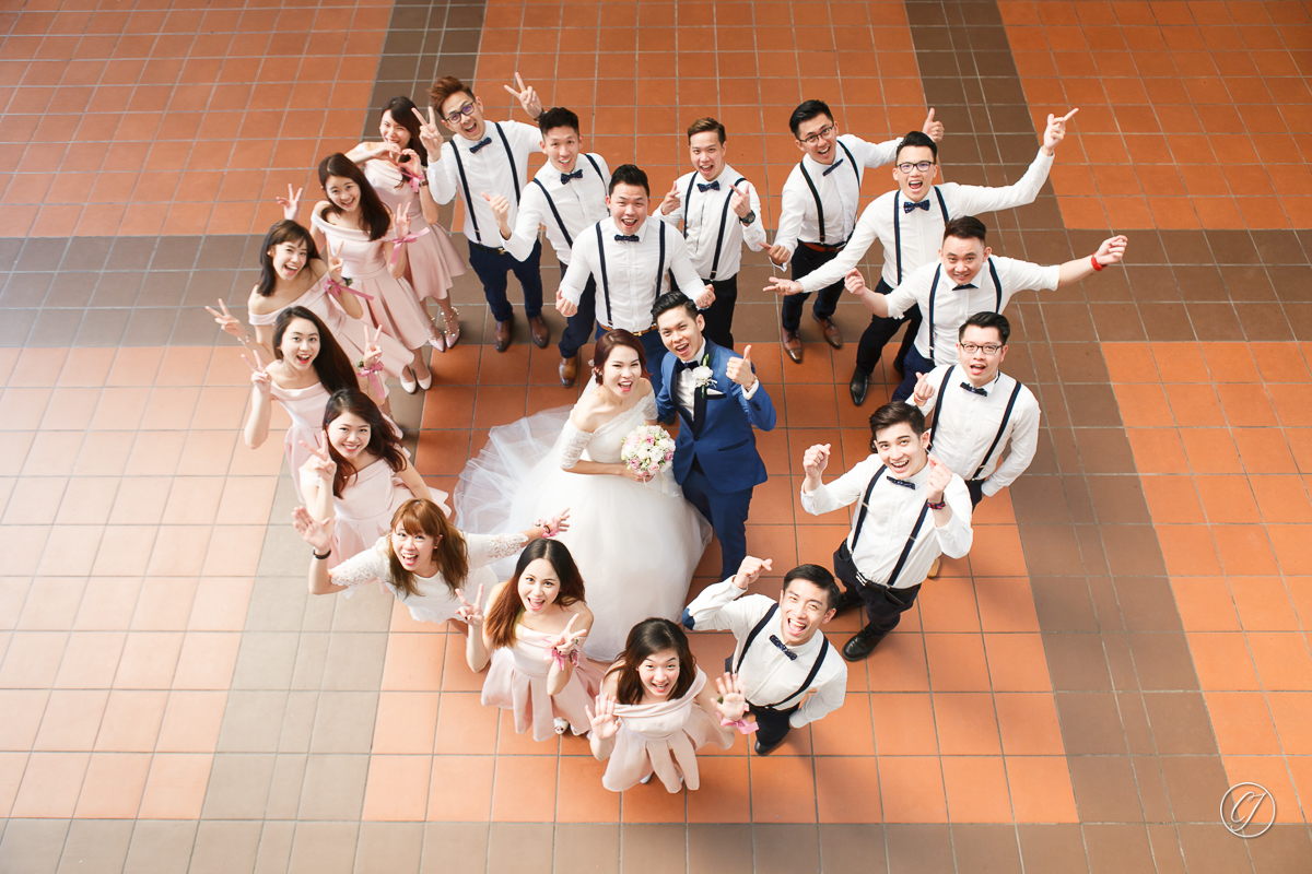 The newly-wed couple and friends with their heart-shape pose for group photo